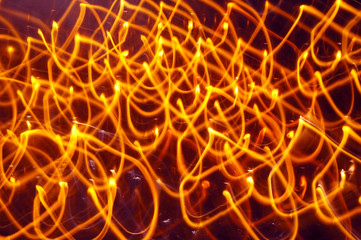 Abstract orange lights shot with long exposure. Motion background, Glowing yellow lines...