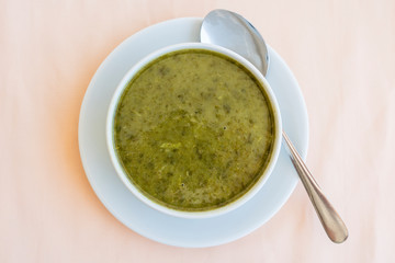 Green cream soup from spinach, close up