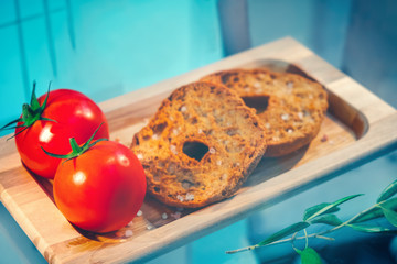 italian food gastronomy hard ring of bread from Puglia regional product called Friselle or Bruschetta or Pane e Pomodoro