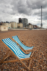 deck chairs on empty dull beach