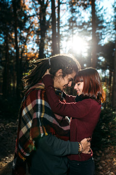 Happy young couple in love in forest