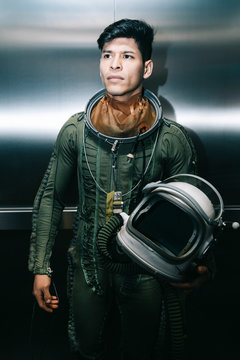 Man posing dressed as an astronaut in an elevator