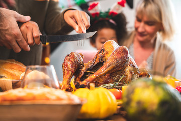 Thanksgiving Celebration Tradition Family Dinner Concept.family having holiday dinner and cutting...