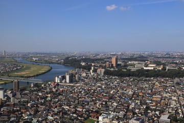 Obraz premium Aerial view of Edogawa River and the suburbs of Tokyo, Japan