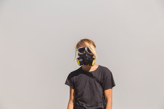 Young woman with respirator mask at Ijen volcano, Java, Indonesia