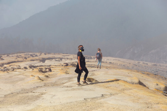 Young women with espirator mask at Ijen volcano, Java, Indonesia