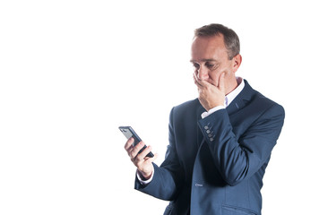 Man in suit on white background struggle with message on smartphone