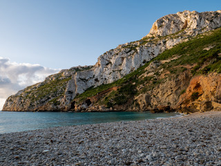  lonely beach la granadella with stones and turquoise water