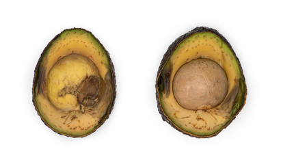 Decaying avocado slices against white background