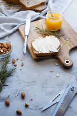 Cozy breakfast with freshly baked sandwiches and curd cheese sandwiches with almonds and lemon zest