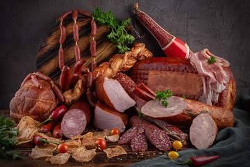  smoked meat and sausages in assortment with herbs and spices