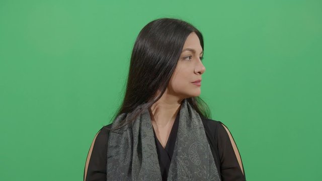 Woman Showing Both Sides Of The Face. Studio Isolated Shot Against Green Screen Background