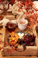 Cozy autumn breakfast with cup of coffee,cracker, fruit and Camembert cheese
