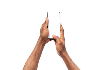 Black man's hands holding cellphone with blank screen, taking photo - obrazy, fototapety, plakaty