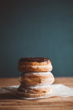 Stack of donuts on wax paper