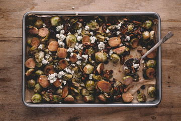 Dried cranberries walnuts and brussels sprouts kept in tray