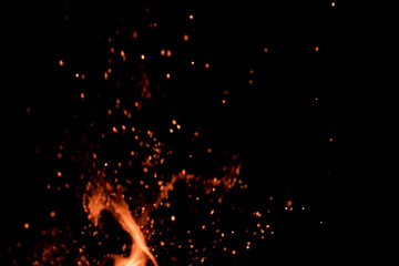 Blured fire sparks with spurt of flame; selective focus; overlay design usage