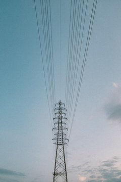 Low angle view of electricity grid against clear sky