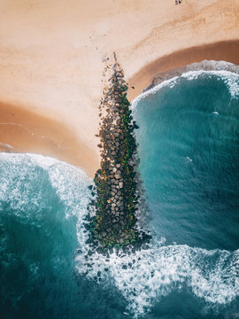 Aerial view of beach with groyne