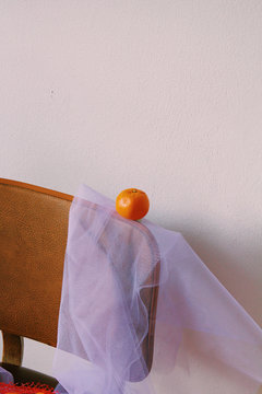 Selective focus of orange on chair