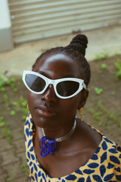 Portrait of woman wearing sunglasses outdoors