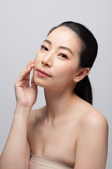 Fototapeta na wymiar Portrait of beautiful young asian woman clean fresh bare skin concept. Asian girl beauty face skincare and health wellness, Facial treatment, Perfect skin, Natural make up. Isolated on gray background