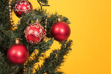 christmas tree decoration detail on color background