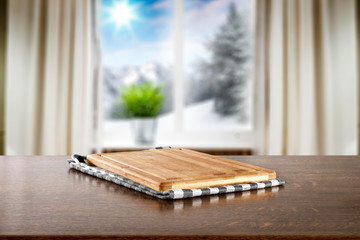 Wooden desk of free space for your product and winter window sill background. 