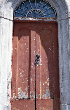 Doorway with chipped painted double doors