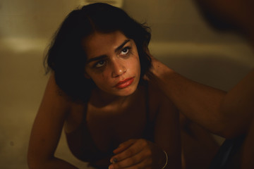 Direct view of woman with smudged eyes being consoled