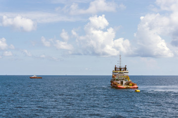 An anchor handling tug boat at oil field