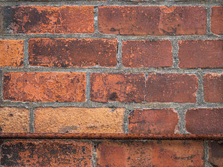 Abstract background and closeup of old and dirty brick tiles or grids pattern, rough cement or concrete texture.