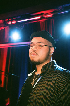 Portrait of young man standing indoors