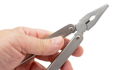 Hand is holding universal pliers on white