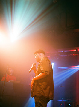 Young man singing during concert