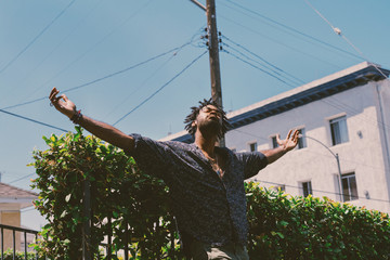 Man spreading his arms