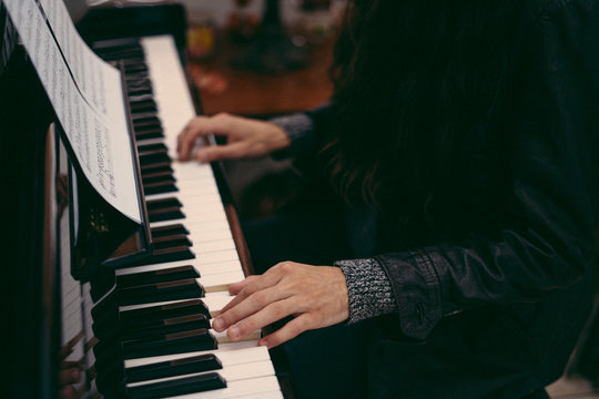 Close up view of man playing piano
