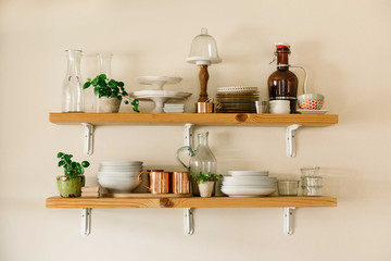 Kitchenware on wooden shelves