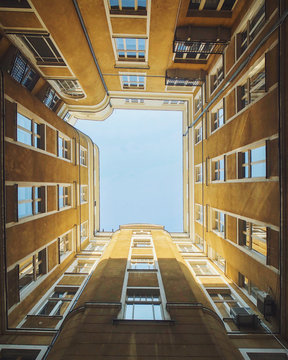 Low angle view of four sides of building from courtyard