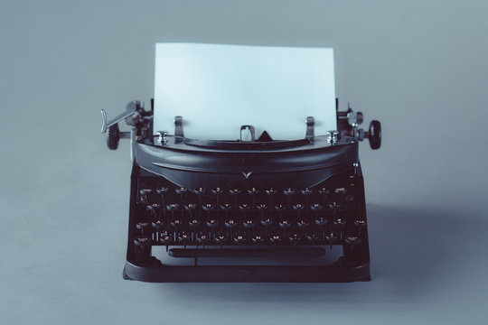 Vintage typewriter with paper