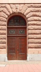 Old wooden door with carved ornaments.