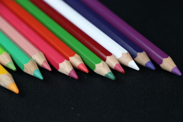 color pencils on wooden background