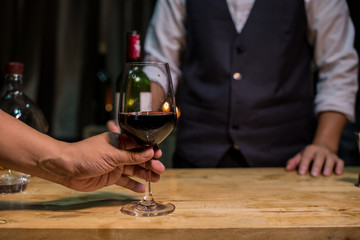 man and woman drinking wine
