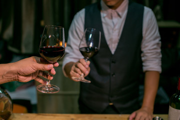 couple toasting with red wine