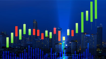 stock graph chart candle stick with bullish hammer sign or Kangaroo tail  and volume diagram with city night on background, stock chart indicator analysis concept