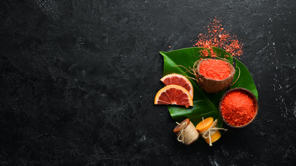 Orange sea salt with aroma of grapefruit. Spa treatments. Top view. Free copy space.