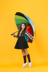 Schoolgirl daily life. Girl with umbrella. Rainy day. Happy childhood. Kid happy schoolgirl with...