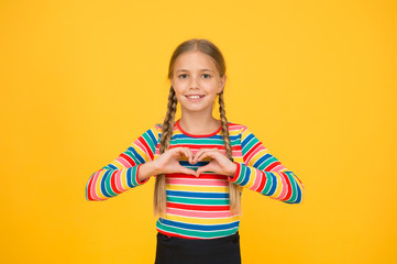 Share love. Adorable girl beautiful face. Little girl. Small child with cute braids hairstyle on...