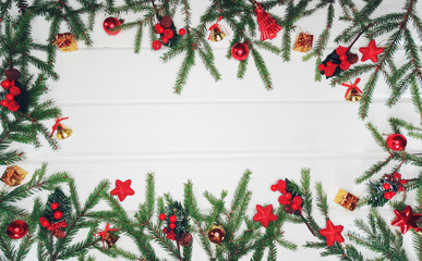 Fototapeta na wymiar christmas decoration and garland lights on white wooden background