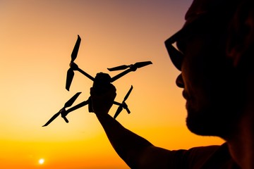 Men Flying Small Drone